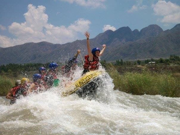Raft splashing through a rapid