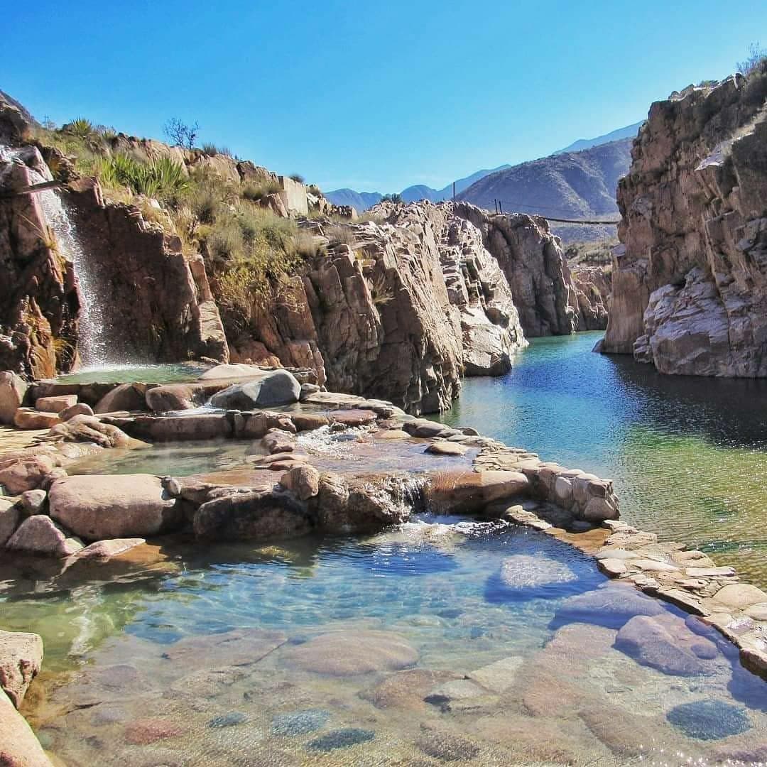 Stone thermal pools surrounded by the canyon